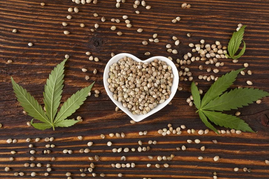 bigstock Hemp Seeds On Wooden Backgroun 119673530